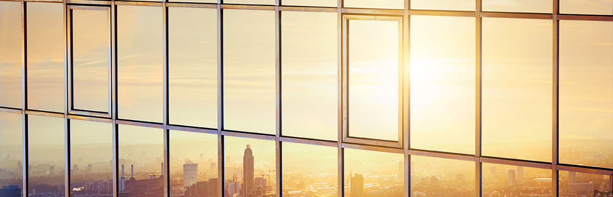 Sunset on glass facade of a modern building