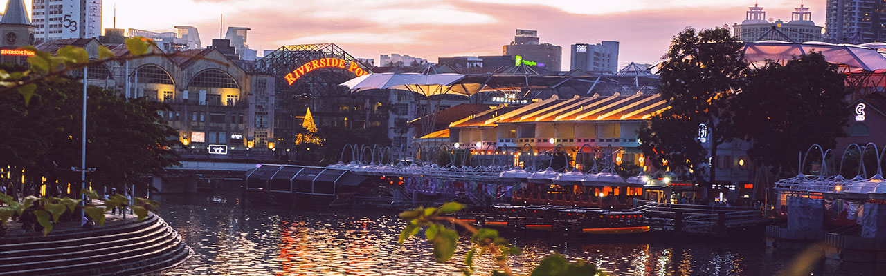 Sunset view of river taxi in Singapore Clarke Quay