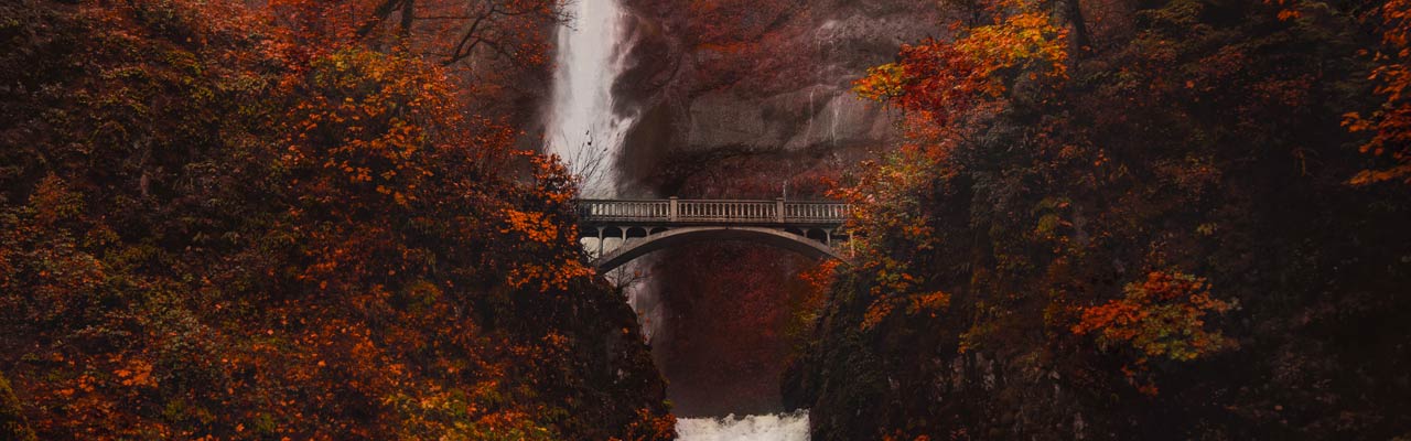 Bridge in front of a Waterfall