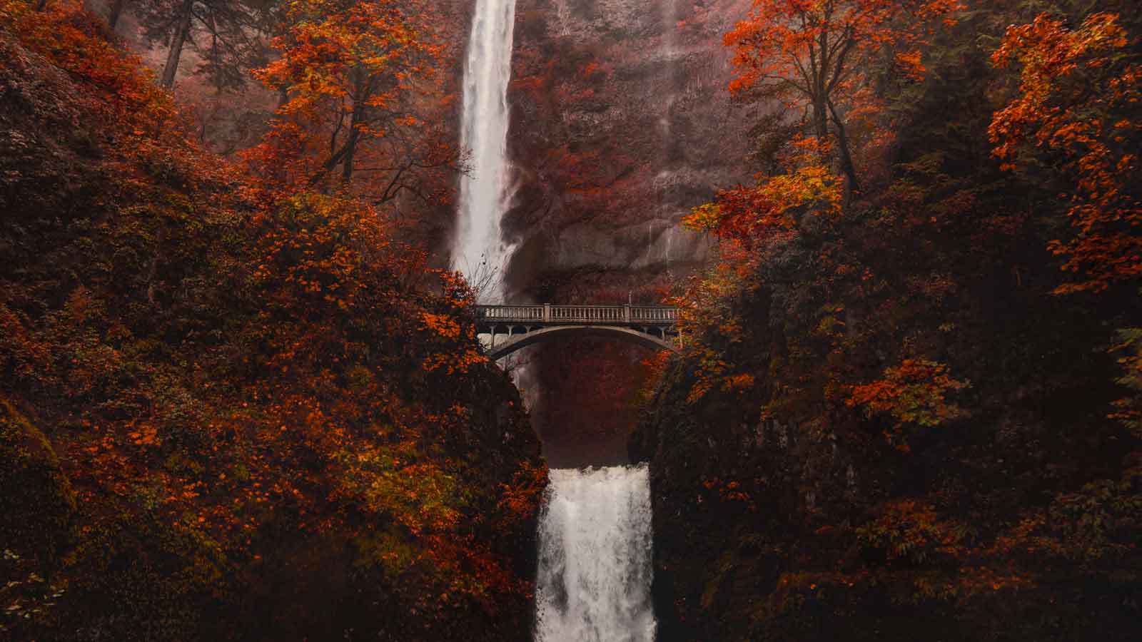 Bridge in front of a Waterfall