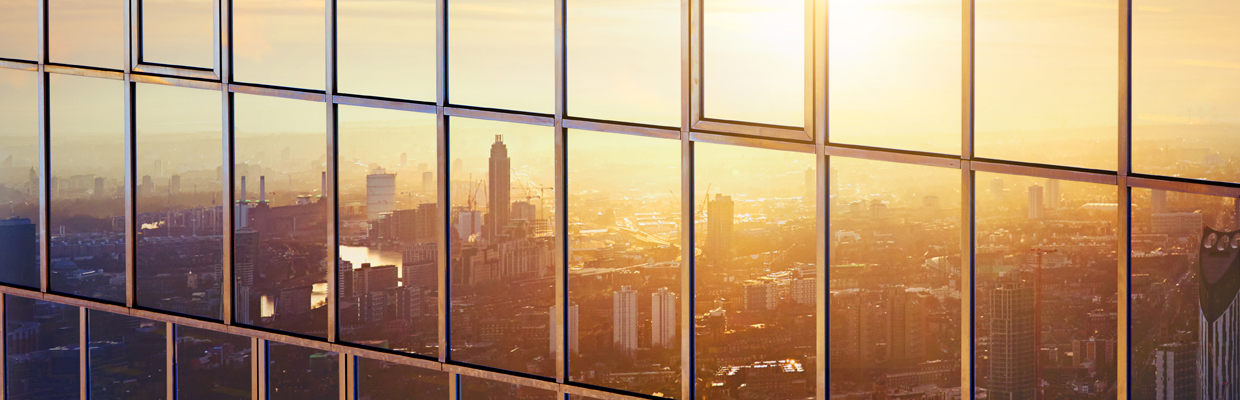 City reflection in building glass