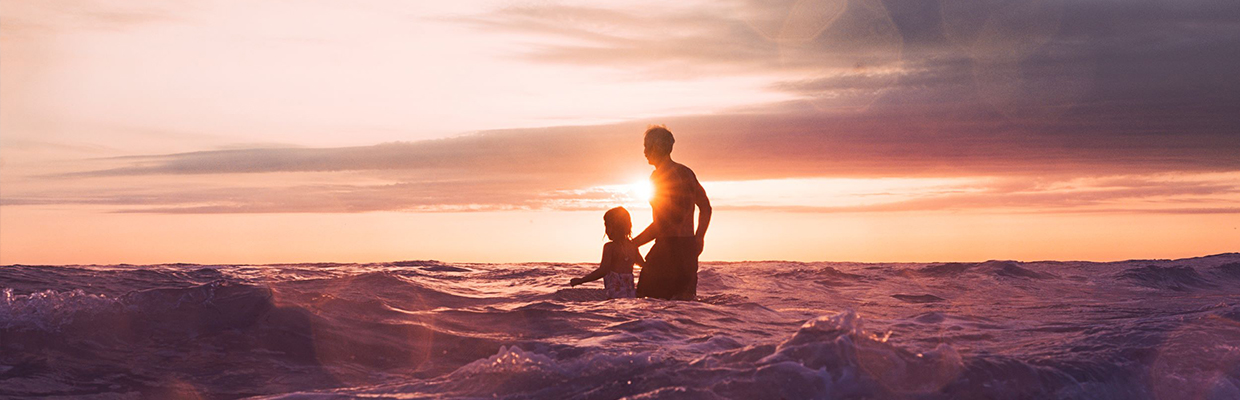 Father and daughter at beach