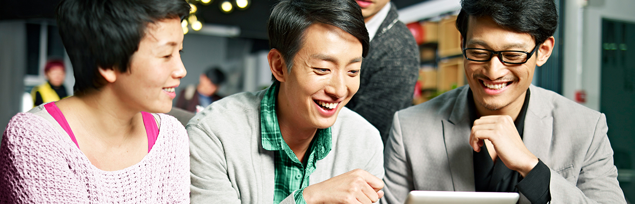 Young Business People Using Tablet In Office