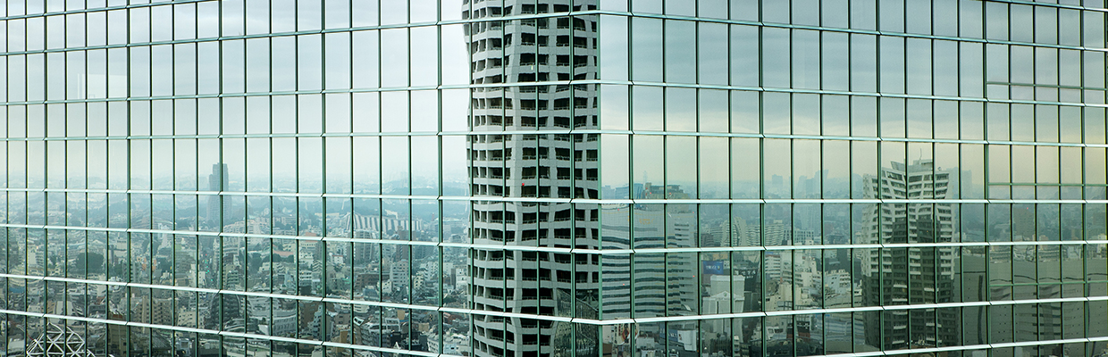 Building reflecting in another building