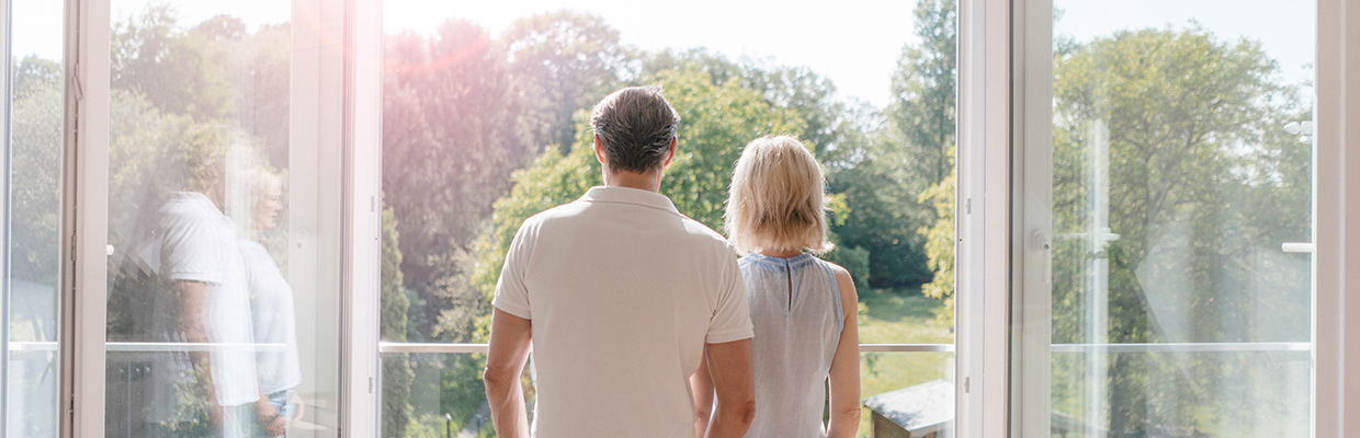 Couple looking outside